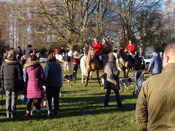 Members of Bedale Hunt on horseback with members of the public in Bedale Park